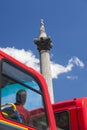 Tourist on Red Bus Looking at Nelson`s Column London England